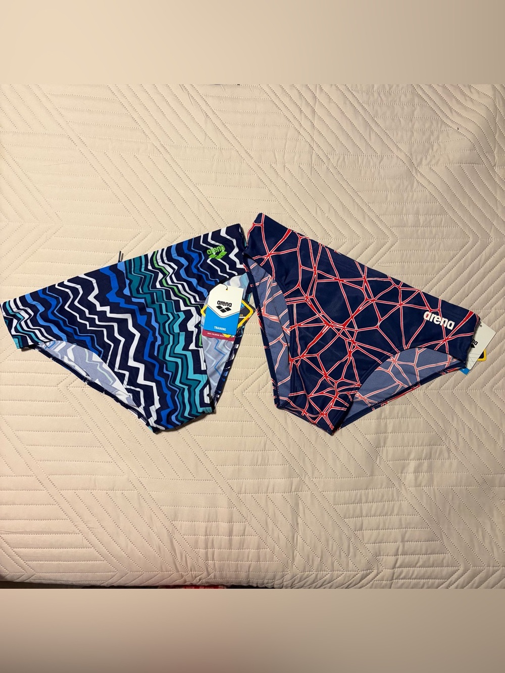 NWT Arena Mens Swim briefs - Navy with Coral Geometric & Multi-Blue Wave
Size 40